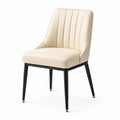 Silla de cuero sintético beige con patas metálicas negras